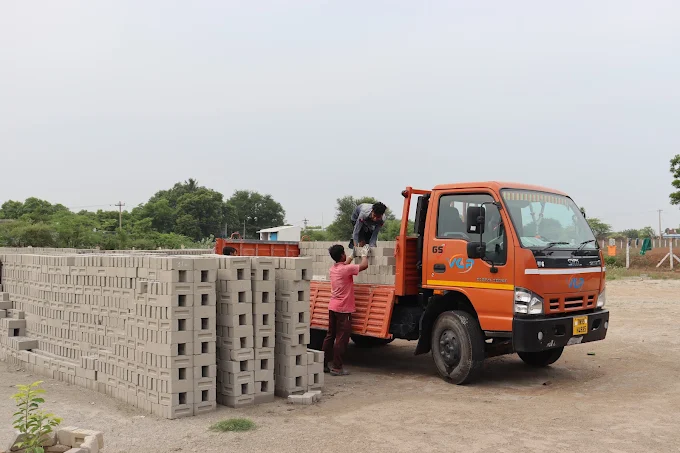 VCP truck loading fly ash bricks for delivery